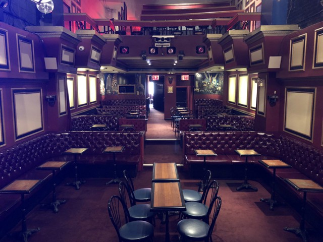 Inside The Triad Theater — leather booths and cabaret tables